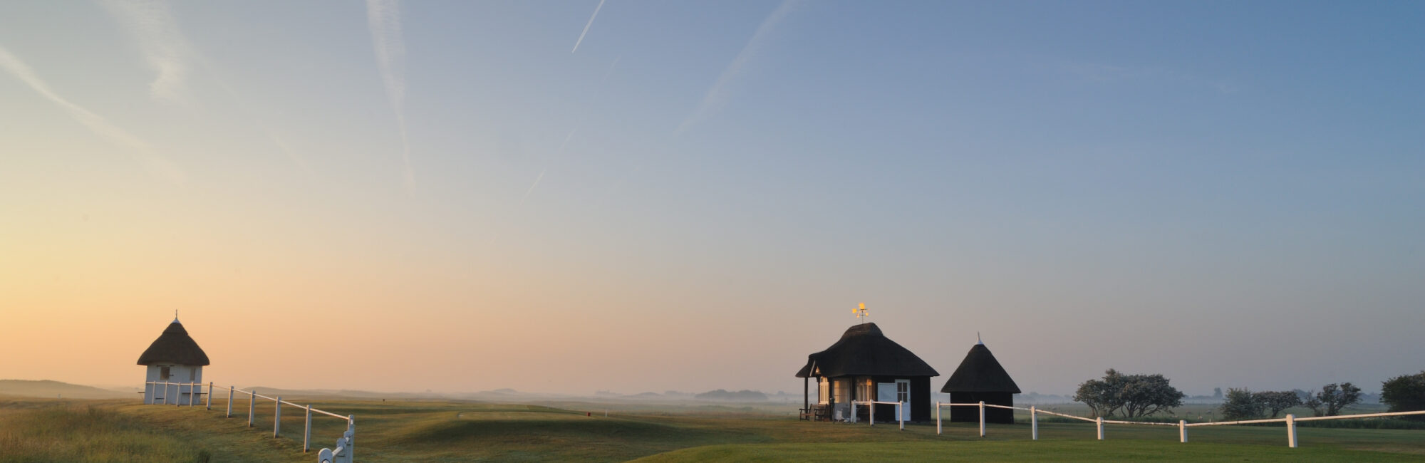Royal St George’s Golf Course in Sandwich with open fairways and greens.