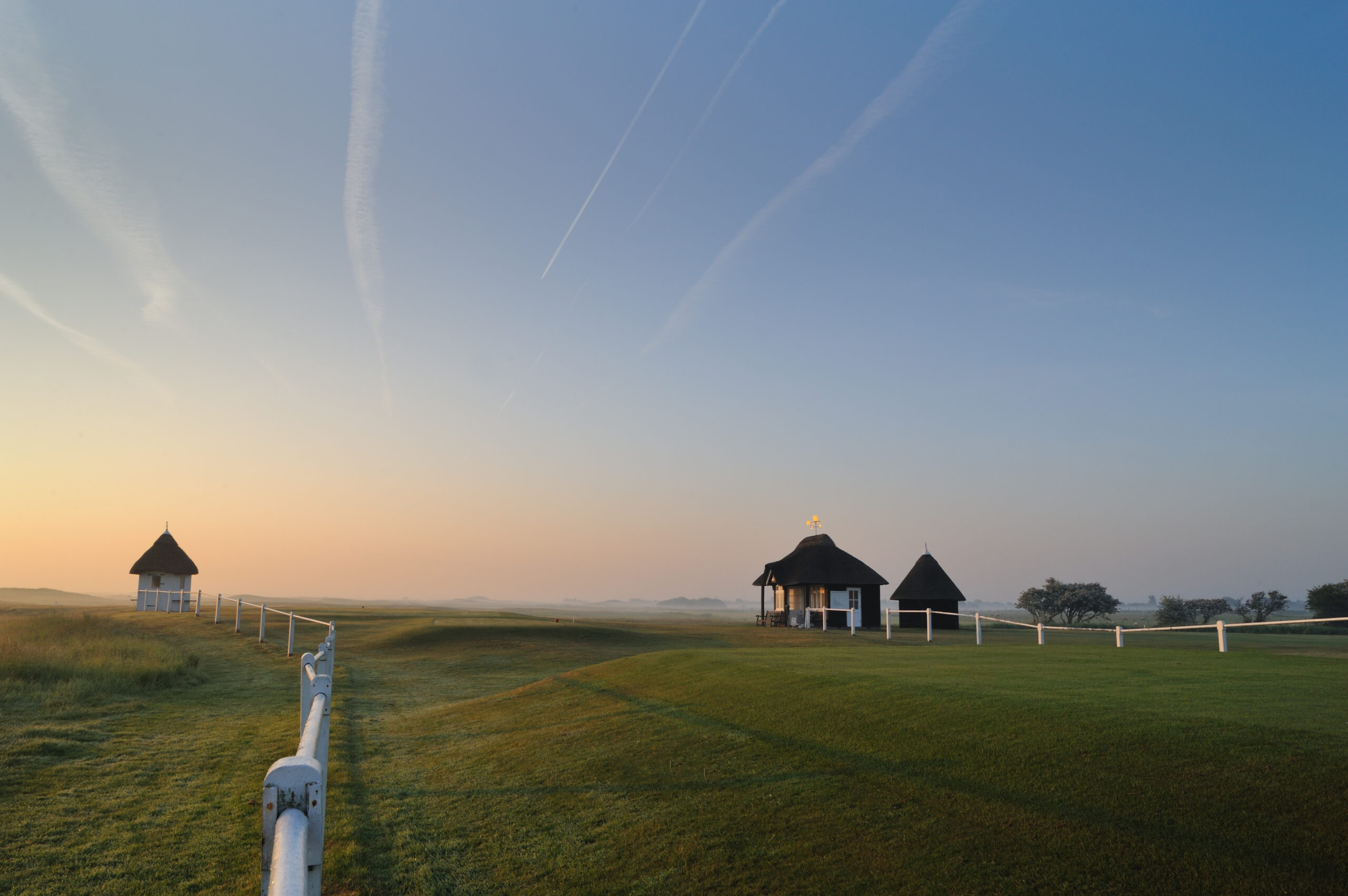 Royal St George’s Golf Course in Sandwich with open fairways and greens.