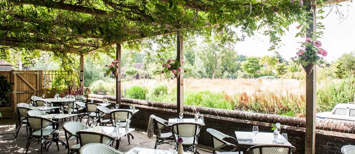 Exterior of The Fordwich Arms, a Michelin star restaurant in Kent, with riverside seating and countryside charm.