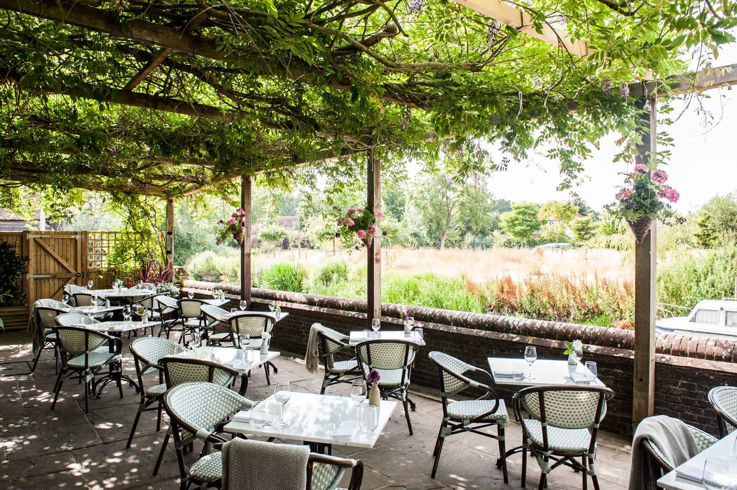 Exterior of The Fordwich Arms, a Michelin star restaurant in Kent, with riverside seating and countryside charm.