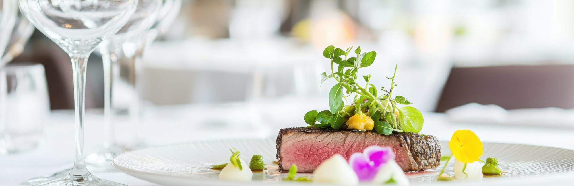 Close-up of a beautifully plated dish at a restaurant in Kent, showcasing seasonal ingredients and elegant presentation.
