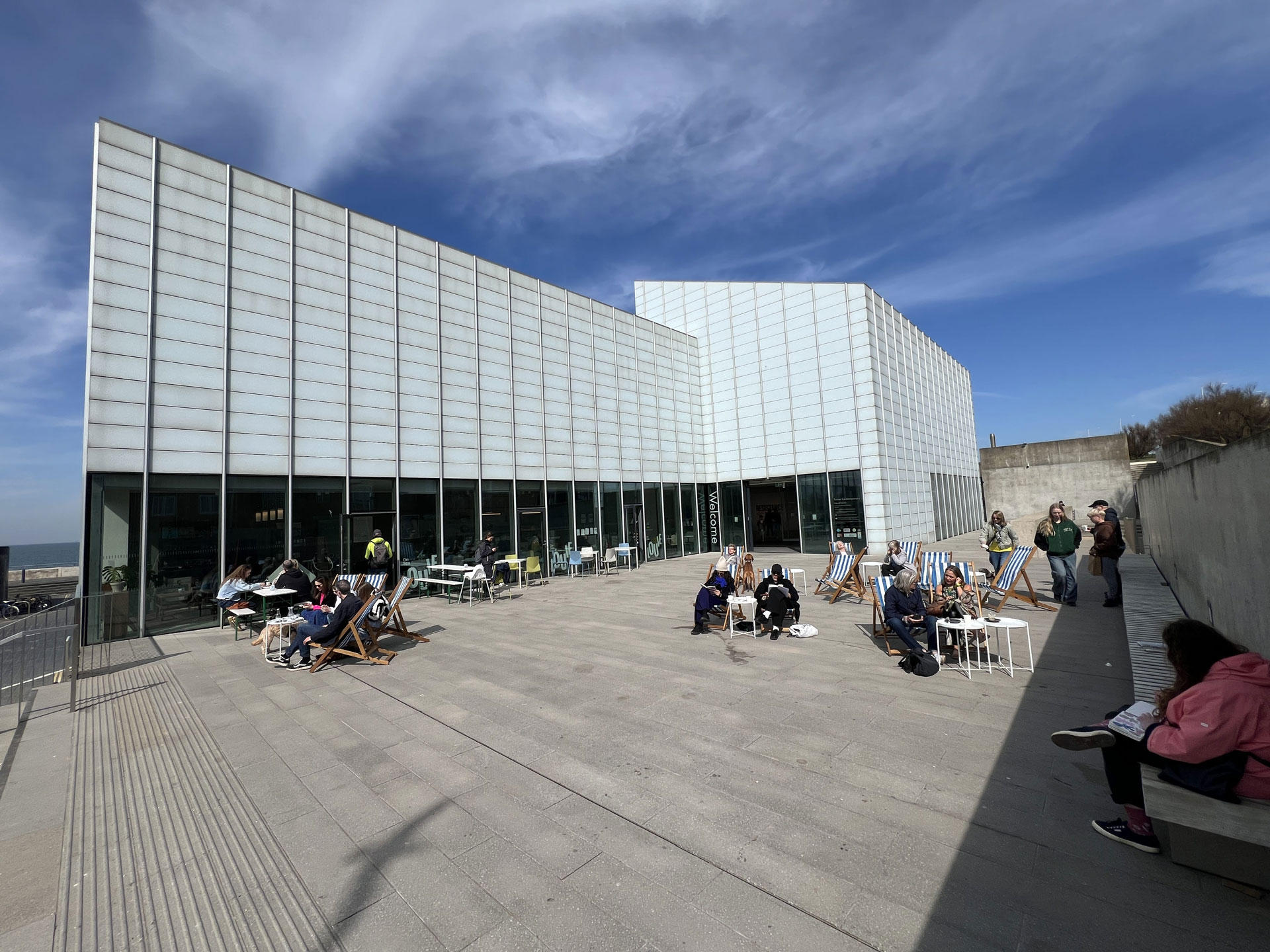 Turner Contemporary building and terrace in Margate with people enjoying the sun