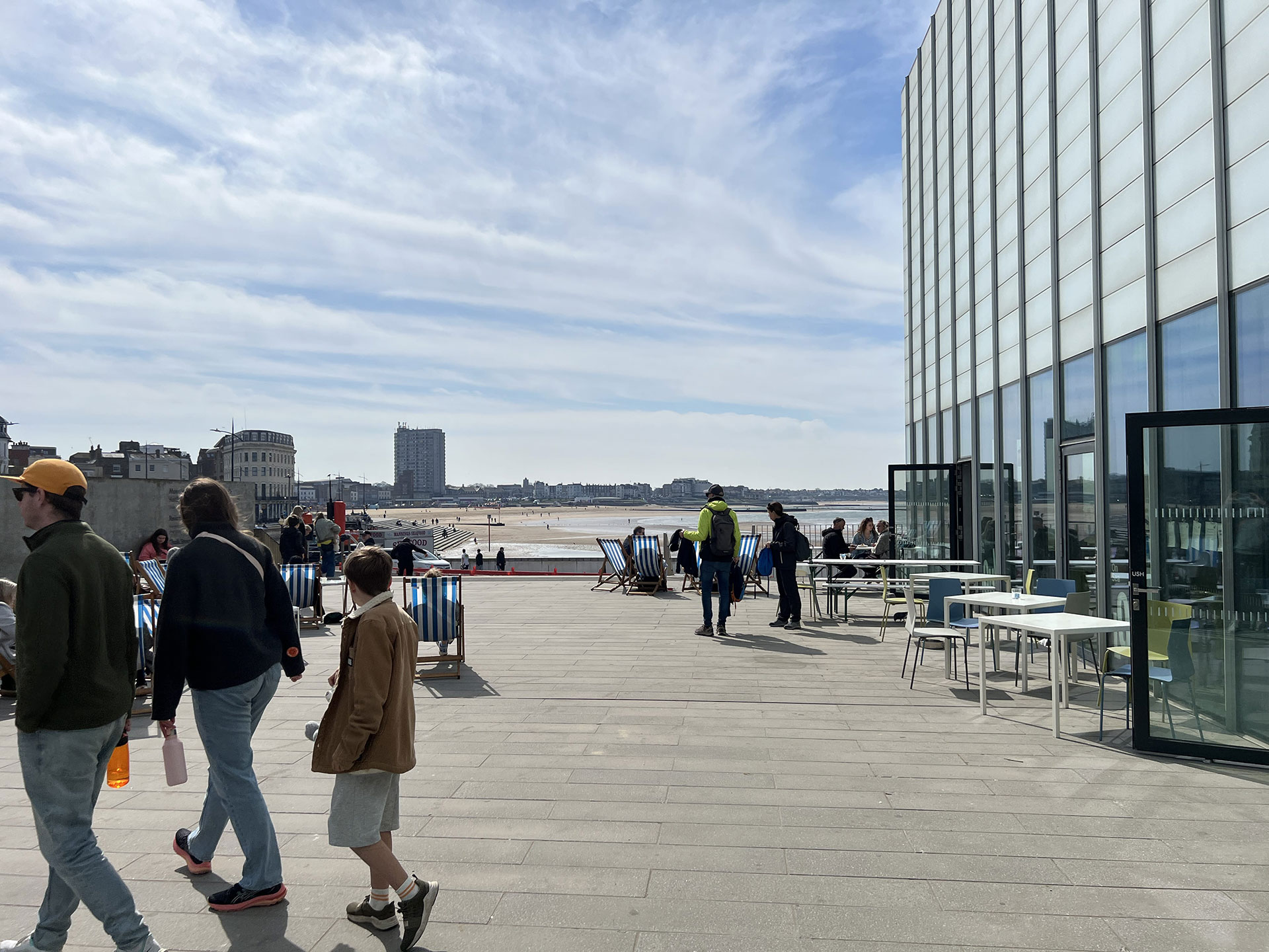 People on the Turner Contemporary terrace with a view of Margate beach